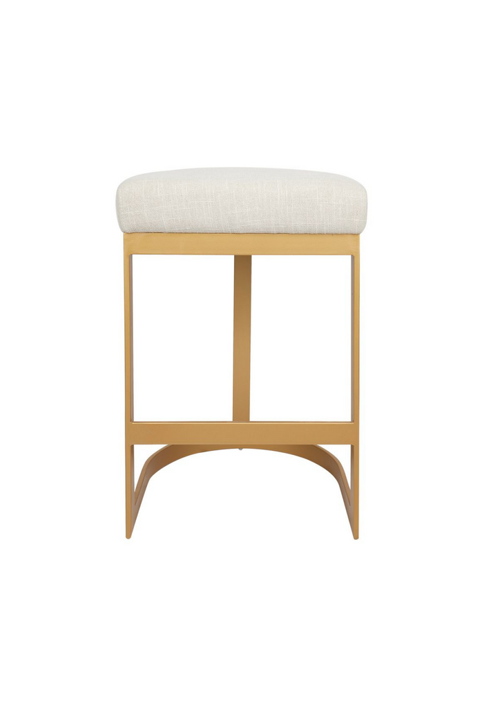 Modern brass coloured bar stool with steel base in round and edgy geometric shapes and a natural linen seat cushion