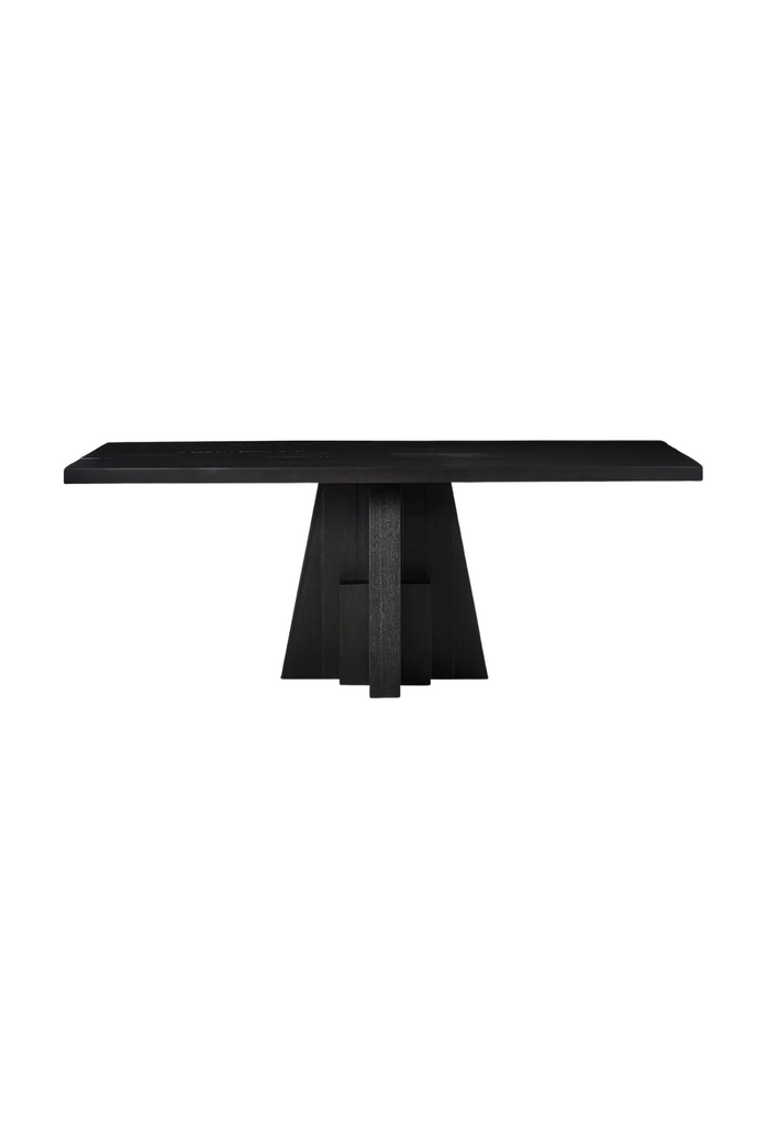 Black Mango Wood Dining Table with Large Rectangular Top and a sculptural geometric shaped base on white background