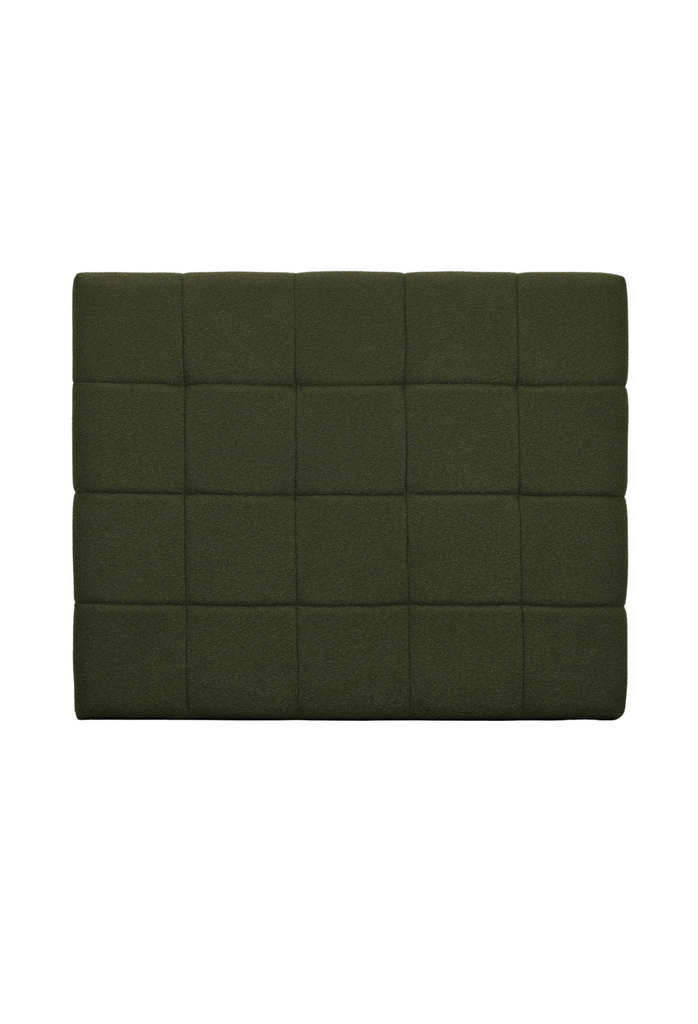 Modern padded bedhead fully upholstered in a dark green plush fabric with square shaped stiching details on a white background