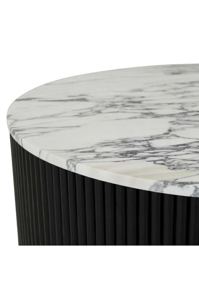 Solid Round Coffee Table with a white marble top and black rippled timber outside on a hidden black metal base