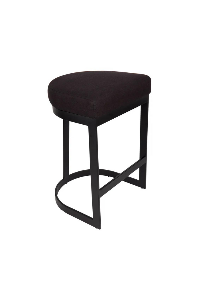 Modern black bar stool with steel base in round and edgy geometric shapes and a black linen seat cushion
