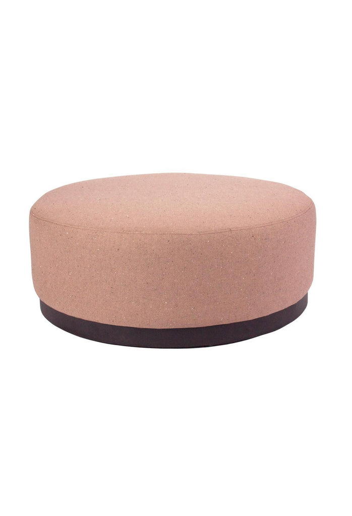 Large round ottoman fully upholstered in an orange rust coloured textured fabric with a black powder-coated metal base