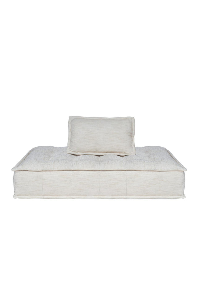 Rectangular Double lounger with button tufting fully upholstered in a natural off-white fabric with matching cushion on a white background