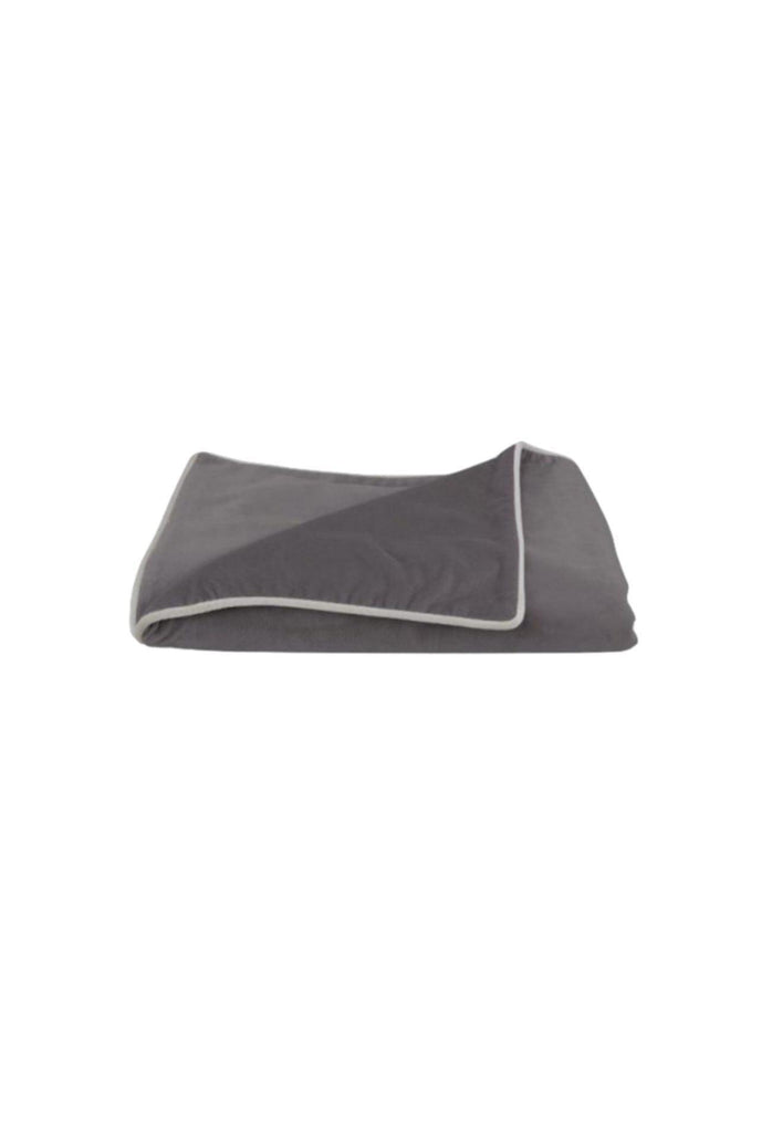 Large dark grey velvet blanket with soft edges and contrast light grey piping on a white background