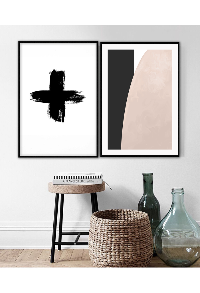 Scandi black and white minimal print with brushstrokes forming a cross on a white background 