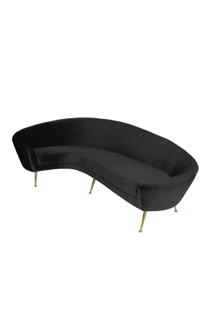 Curved black velvet sofa with equally curved back rest and thin brushed gold metal legs on white background