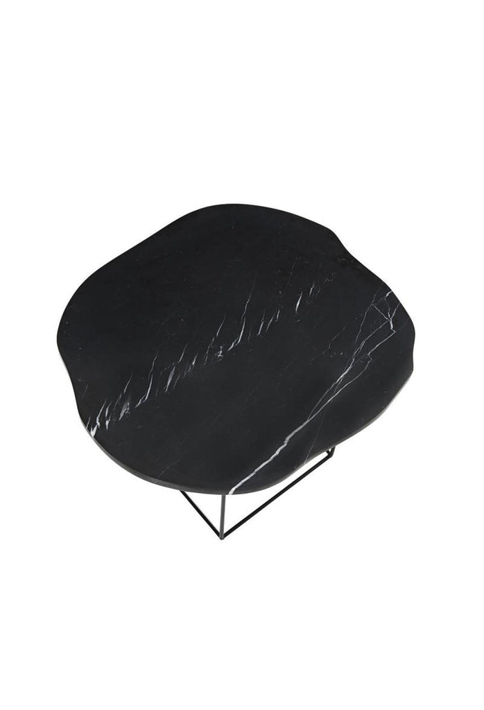 Side Table with black marble top in organic round shape and a black metal frame on a white background