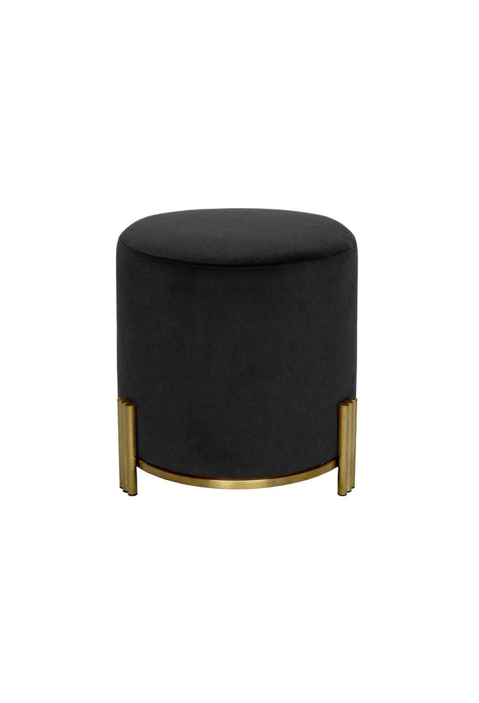 Modern round ottoman fully upholstered in black velvet featuring three ribbed brushed gold legs on white background