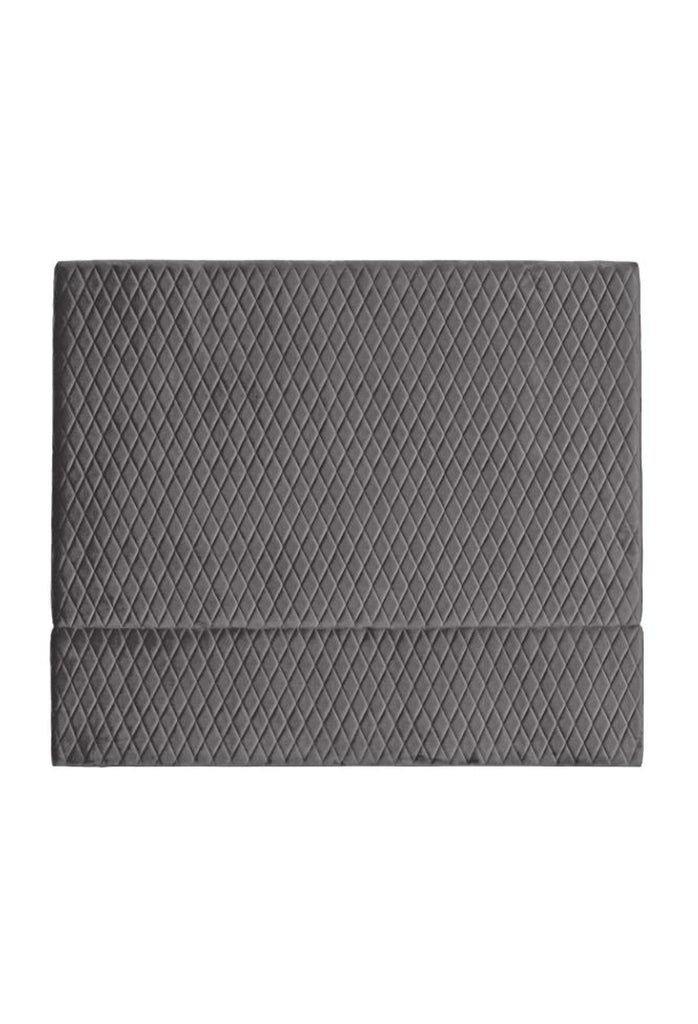 Square shaped quilted bedhead fully upholstered in dark grey velvet with quilting creating a diamond pattern