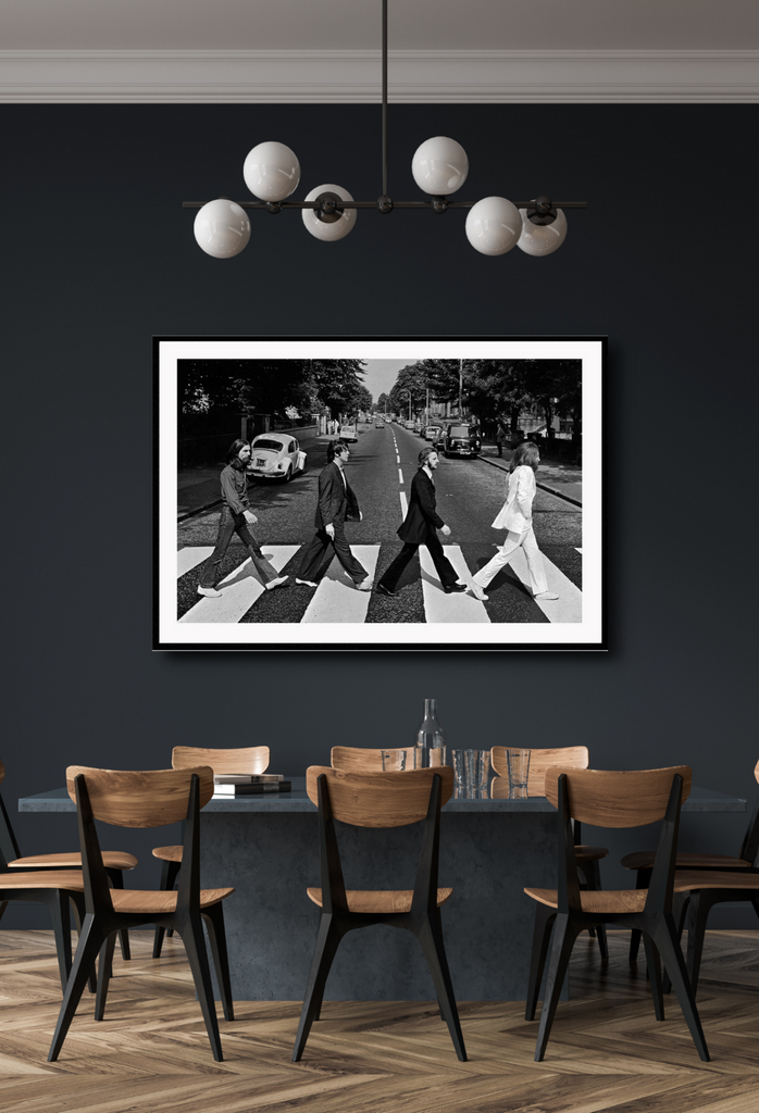 Black and white iconic photography print of the Beatles crossing abbey road in suits.
