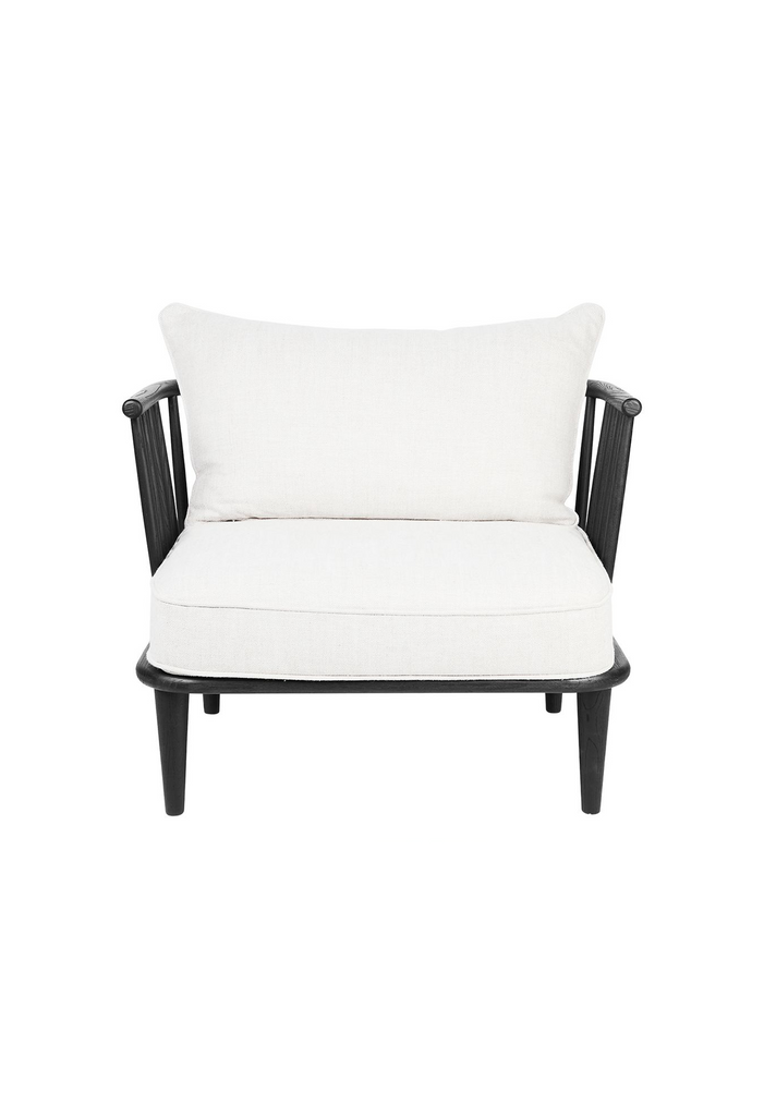 Black wooden spindle chair with white linen seat and back cushions on a white background