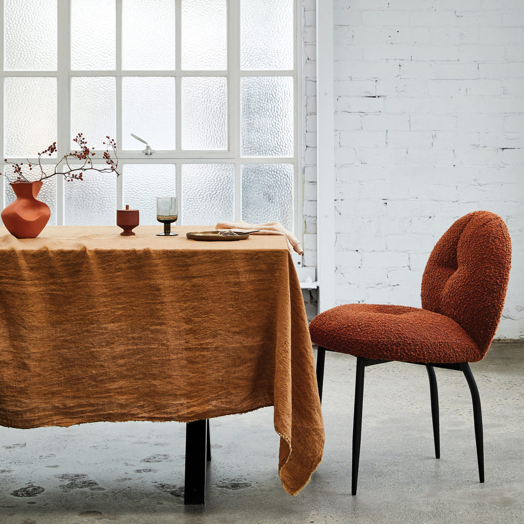 Rounded brick boucle dining chair