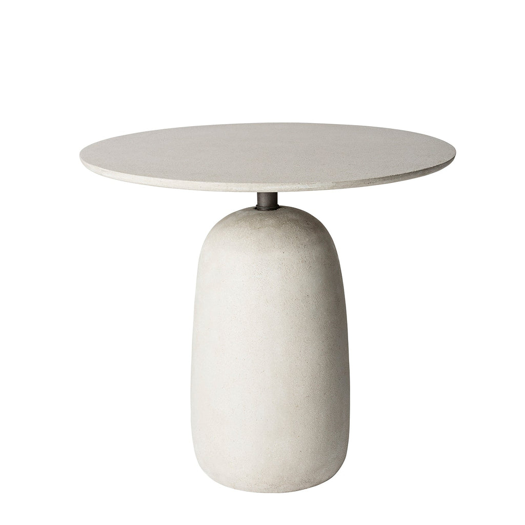 Small round outdoor table with a light grey stone finish and a solid round base on a white background