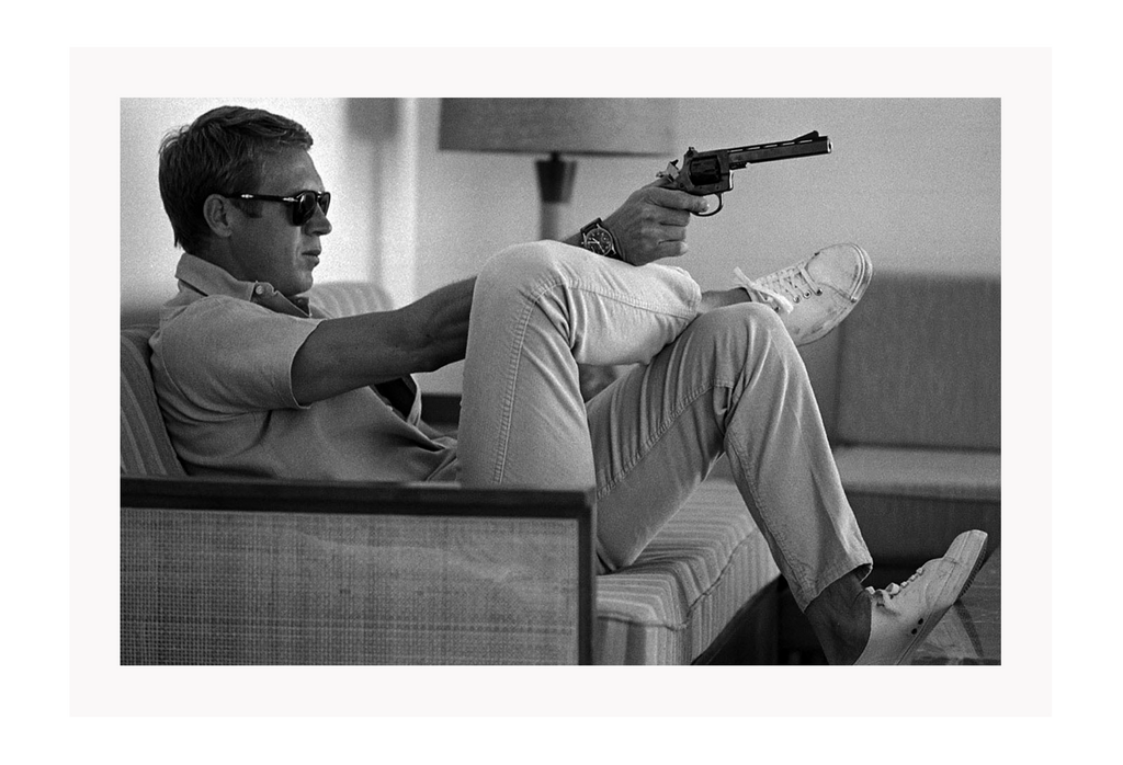 Iconic Steve Mqueen holding a gun landscape photography black and white 