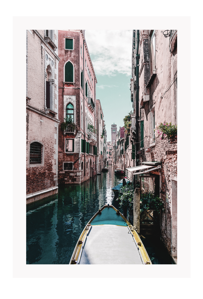 Boat travelling canal in italy blue and pink tones clouds in the sky portrait print 