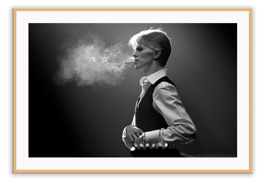 David Bowie iconic smoking photography in black and white dark and moody style 