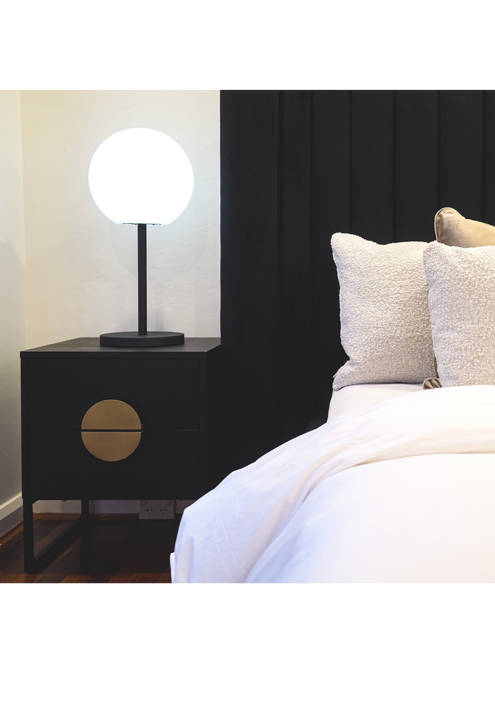 Black Cubic Timber Bedside Table with two drawers featuring gold halfmoon shaped metal handles and black metal legs