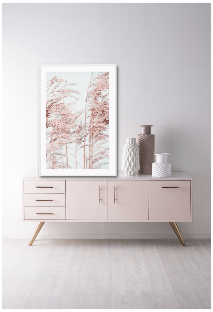 Natural minimal print with pink trees in blowing in wind and blue sky in background boho pastel style 