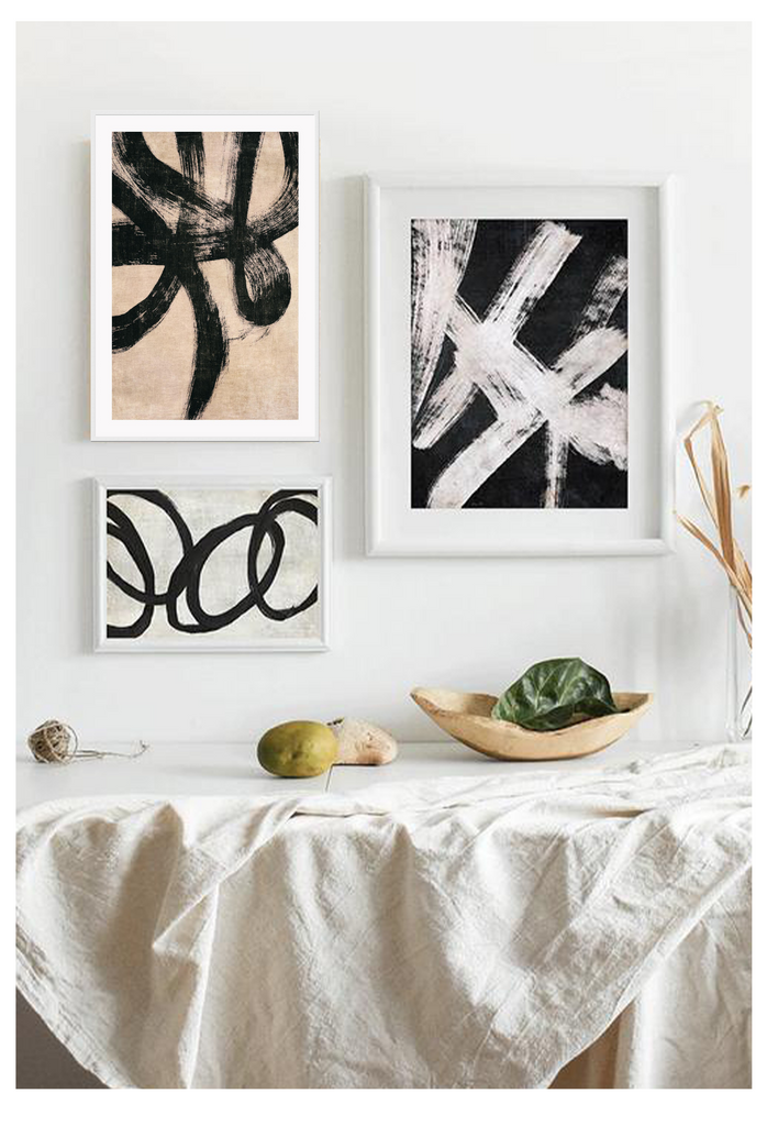 Abstract print with black brushstokes squiggle lines on textured paper with beige background in moody minimal style 