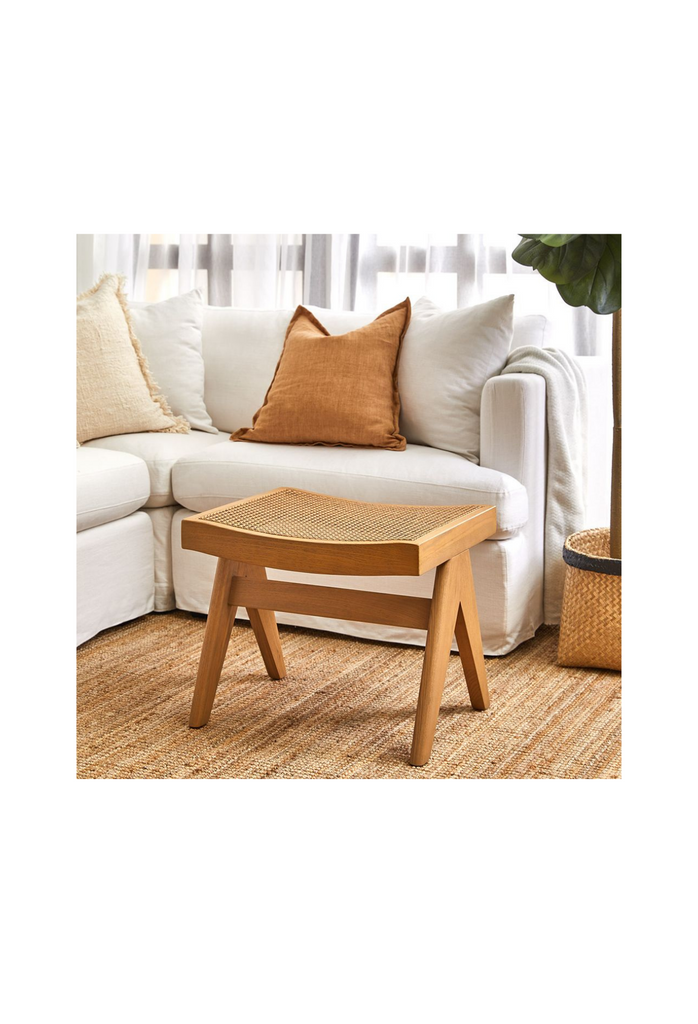 Scandi-Style stool with solid natural wooden legs and a natural rattan seat on white background