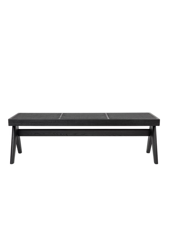 Simplistic Bench Ottoman with sturdy black timber legs and a black rattan top / seat on a white background