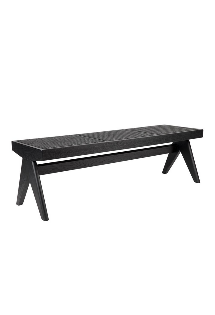 Simplistic Bench Ottoman with sturdy black timber legs and a black rattan top / seat on a white background