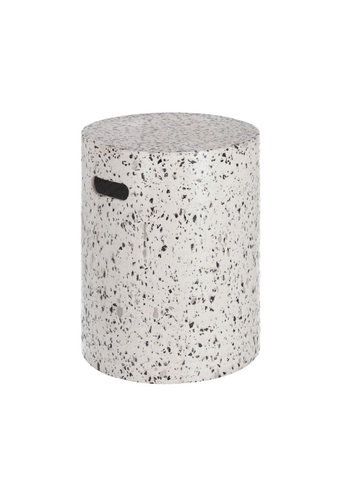 Minimalistic cylinder shaped stool in black and white terrazzo with two handles on a white background