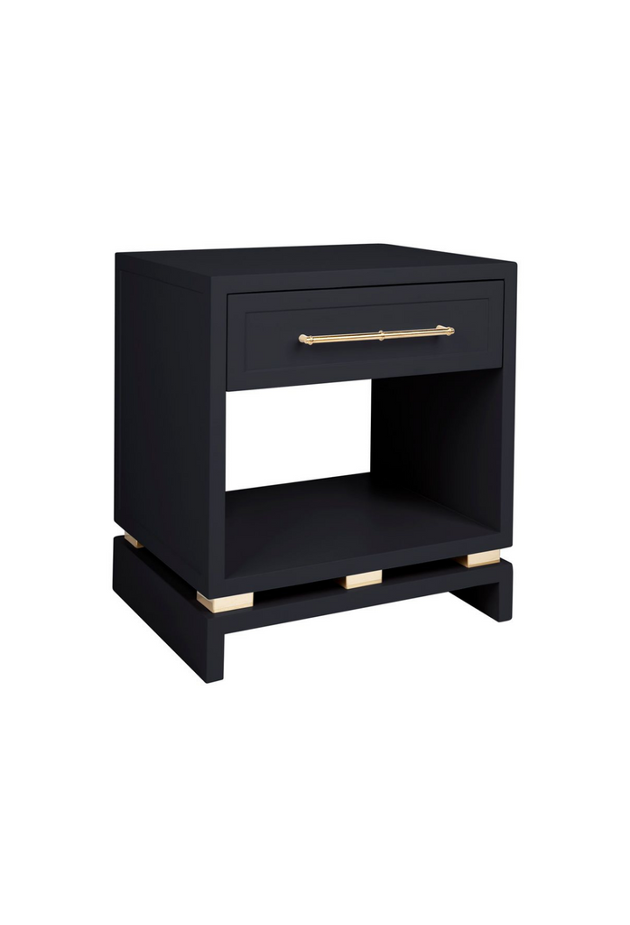 Black Bedside Table with a top drawer featuring Gold Handles and Detailing and a storage compartment in the middle on a white background