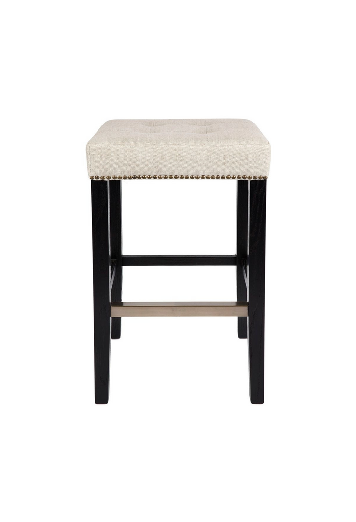 Black Bar Stool with Natural Linen Seat Cushion and Brass Stud Detailing on a white background