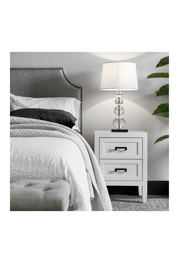 Chunky White Bedside Table with Two Deep Drawers feautring geometric shaped gold handles and panelling on the front