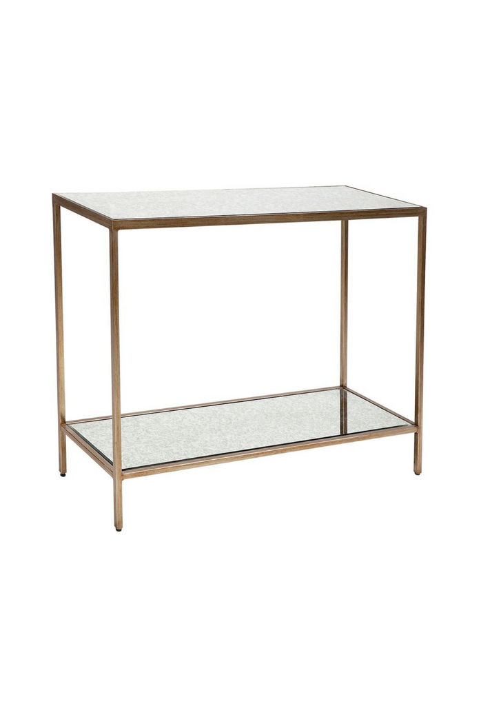 Two tier rectangular console table with sharp edges and an antique gold iron frame featuring a mirrored top and shelf