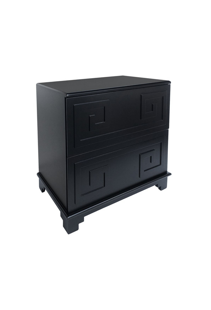 Black cubic wooden bedside table with two large drawers and greek inspired ornaments on the front