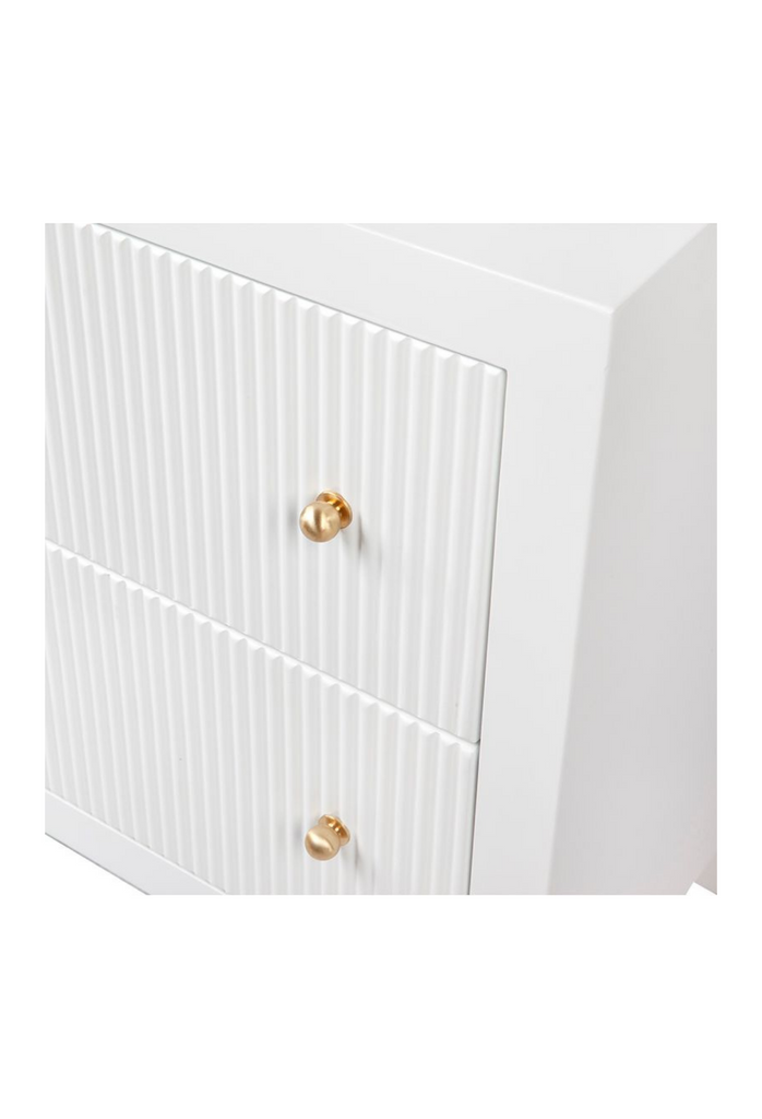 White Bedside Table with Fluted Drawers and Brass Gold Handles on a white background