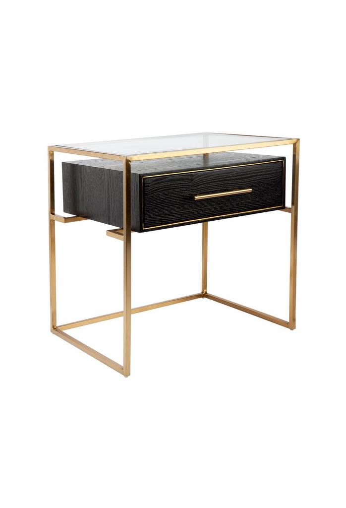 Modern Bedside Table with a Sleek Gold Steel Frame a slim black wooden Drawer and Glass Top on a white background
