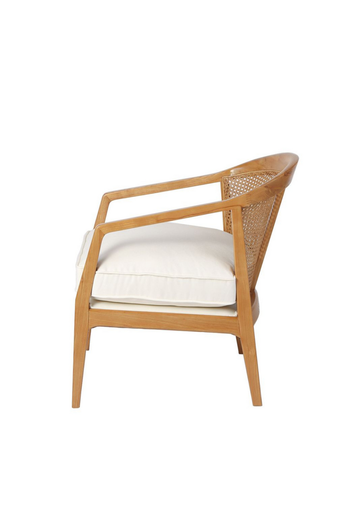 Natural timber occasional armchair with a curved back rest featuring rattan detailing and a white linen seat cushion