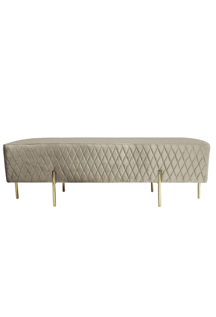 Minimalistic Bench Ottoman Upholstered in a Quilted Vintage Gold Fabric with Six Thin Gold Finish Steel Legs on a White Background
