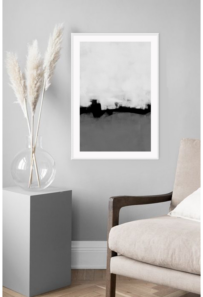 Abstract modern minimalistic print with grey and white painted textures seperated by a black line.