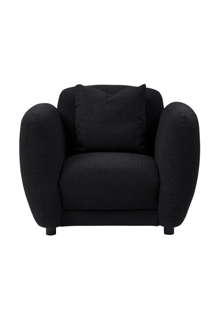 Chunky Armchair with generous back and arm rests fully upholstered in charcoal black boucle with matching cushion and round matte black feet