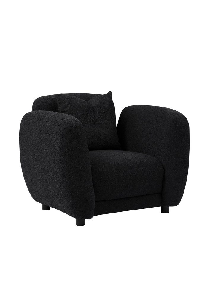 Chunky Armchair with generous back and arm rests fully upholstered in charcoal black boucle with matching cushion and round matte black feet