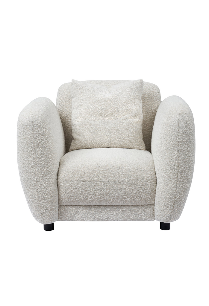 Chunky Armchair with generous back and arm rests fully upholstered in white boucle with matching cushion and round matte black feet