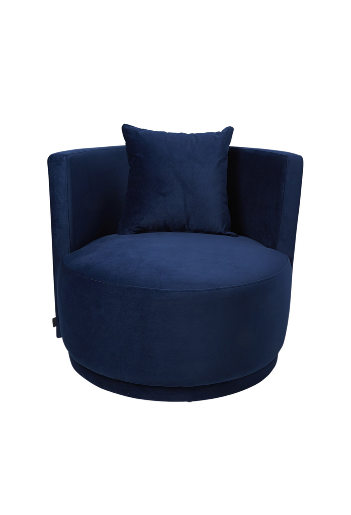 Navy blue velvet tub style armchair with a curved back rest and matching cushion on a white background