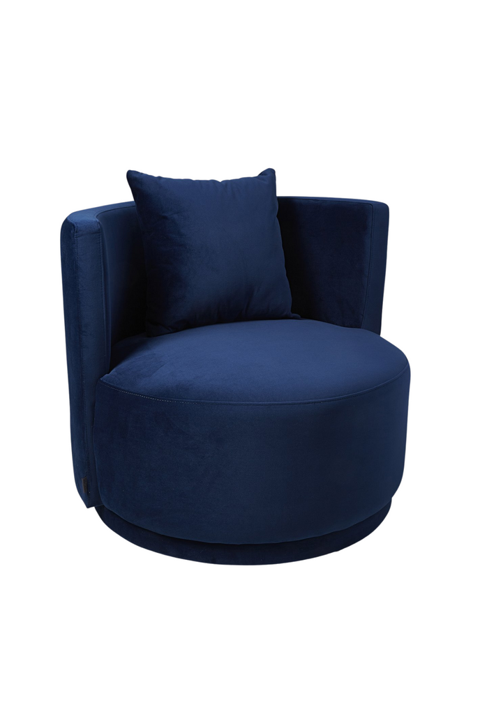 Navy blue velvet tub style armchair with a curved back rest and matching cushion on a white background