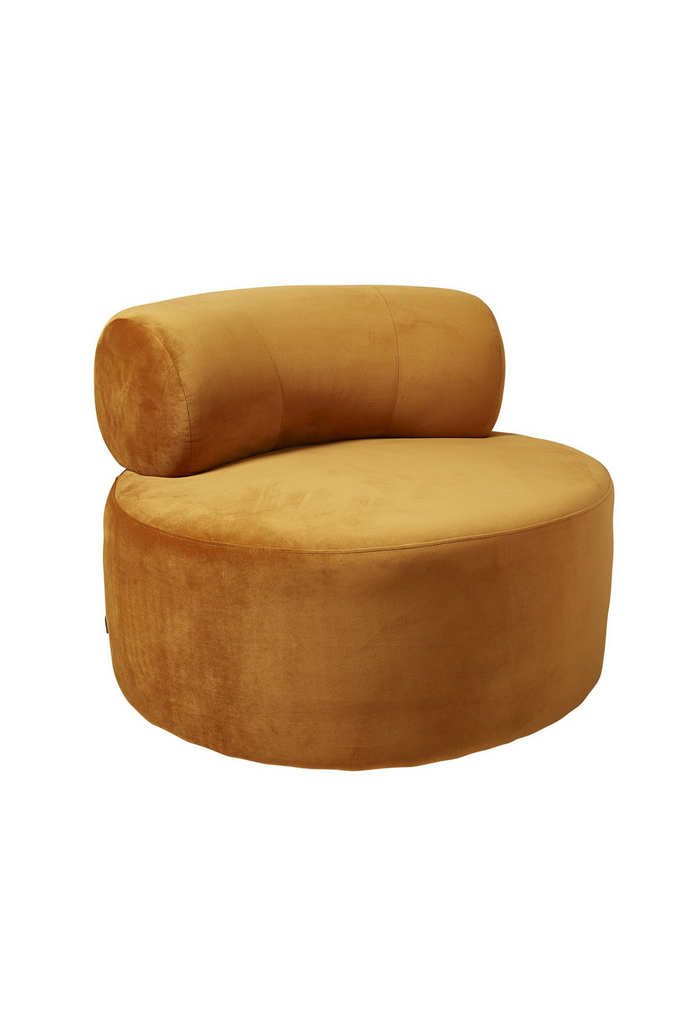 Chunky round swivel chair in orange cognac velvet with matching curved back rest on white background