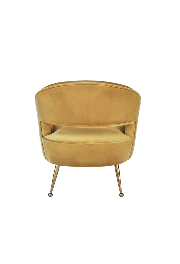 Yellow honeycomb coloured velvet tub style chair with open back and brass gold legs on a white background