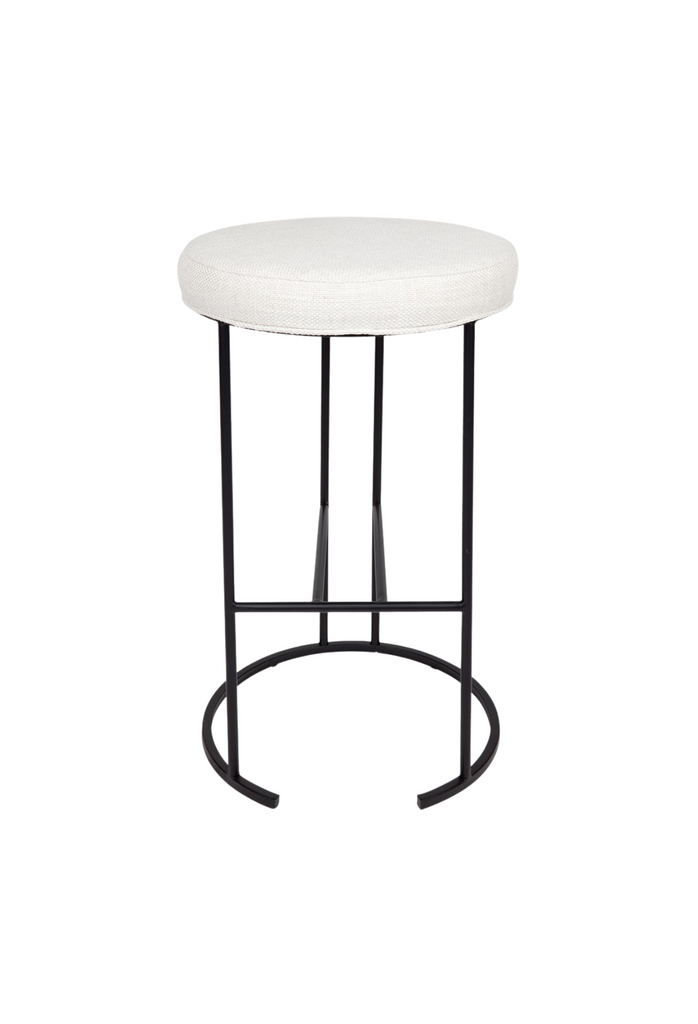 High kitchen / bar stool with a geometric wired black metal base and foot rest and a round white linen seat cushion