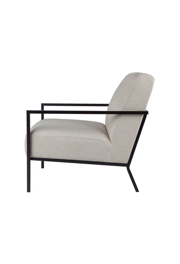 Minimalistic Armchair with a thin matte black metal frame in straight lines and arm and back rest upholstered in natural coloured linen