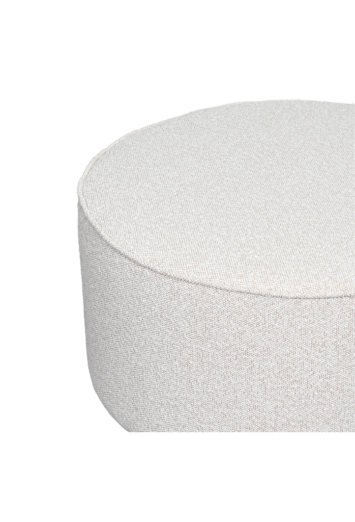 Large Round Ottoman Fully Upholstered in Textured Ivory Oatmeal Coloured Fabric with Piped Edges on White Background