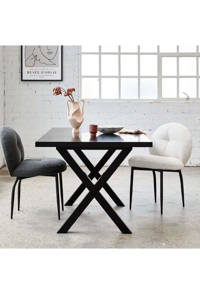Rounded white back dining chair with black metal legs