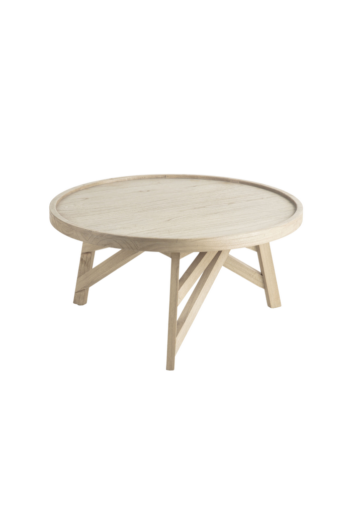 Small round coffee table made of natural wood in a natural light grey wash finish on white background