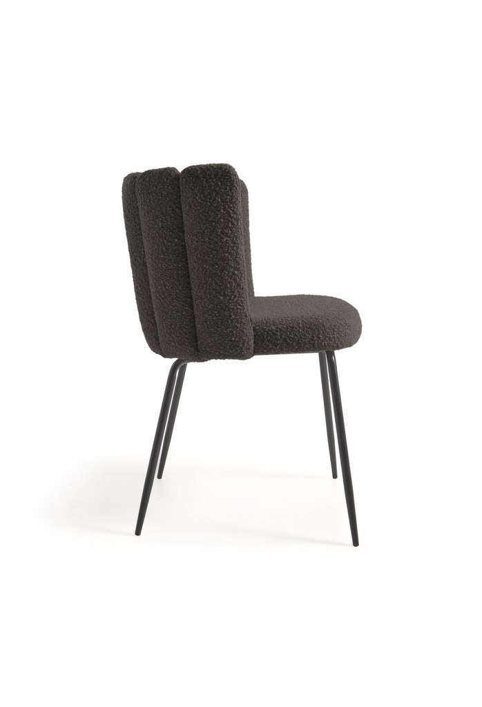 Black boucle dining chair with tubular back design